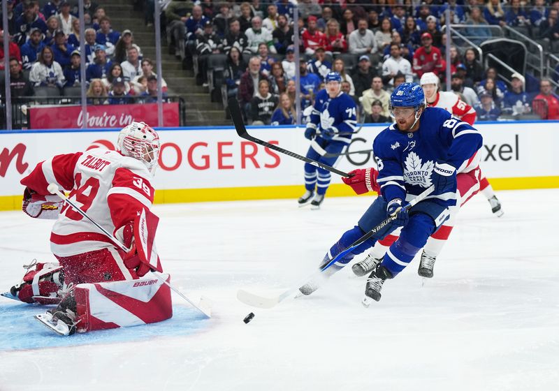Oct 2, 2025; Toronto, Ontario, CAN; Toronto Maple Leafs right wing William Nylander (88) attempts a shot on Detroit Red Wings goaltender Cam Talbot (39) during the first period at Scotiabank Arena. Mandatory Credit: Nick Turchiaro-Imagn Images
