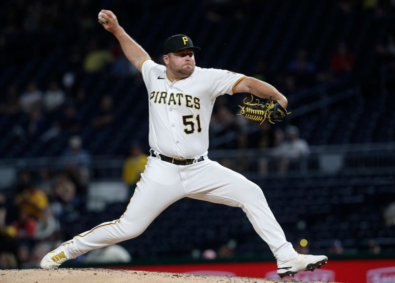 May 22, 2023; Pittsburgh, Pennsylvania, USA;  Pittsburgh Pirates relief pitcher David Bednar (51) pitches against the Texas Rangers during the ninth inning at PNC Park. The Pirates won 6-4.Mandatory Credit: Charles LeClaire-USA TODAY Sports