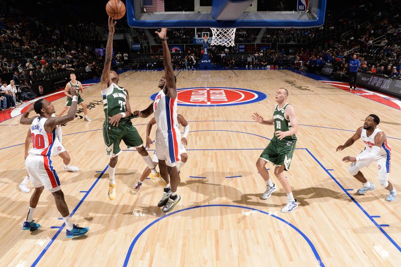 DETROIT, MI - OCTOBER 6: AJ Johnson #77 of the Milwaukee Bucks drives to the basket during the game against the Detroit Pistons during a NBA preseason game on October 6, 2024 at Little Caesars Arena in Detroit, Michigan. NOTE TO USER: User expressly acknowledges and agrees that, by downloading and/or using this photograph, User is consenting to the terms and conditions of the Getty Images License Agreement. Mandatory Copyright Notice: Copyright 2024 NBAE (Photo by Chris Schwegler/NBAE via Getty Images)