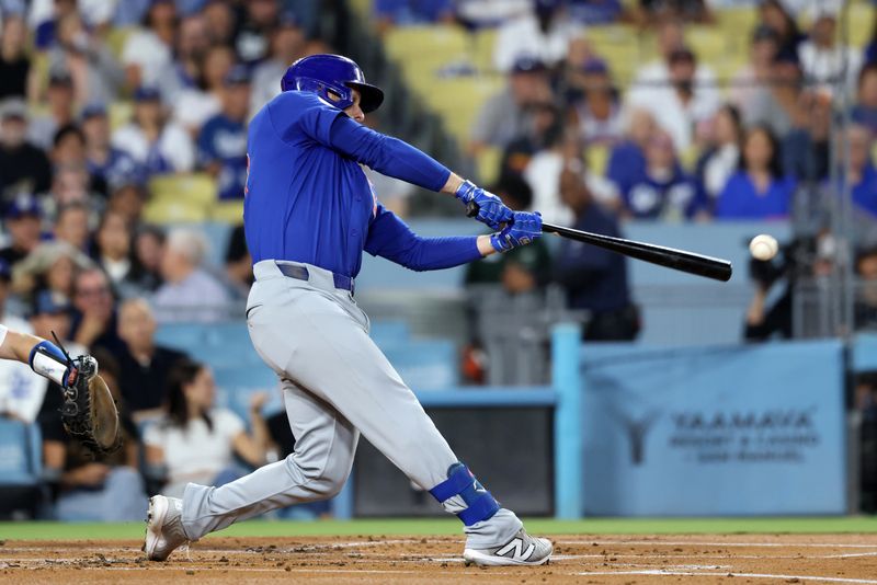 Sep 11, 2024; Los Angeles, California, USA;  Chicago Cubs first baseman Michael Busch (29) hits an RBI double during the first inning against the Los Angeles Dodgers at Dodger Stadium. Mandatory Credit: Kiyoshi Mio-Imagn Images