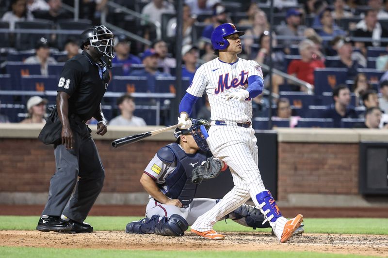 Jun 25, 2025; New York City, New York, USA;  New York Mets right fielder Juan Soto (22) hits a solo home run in the seventh inning against the Atlanta Braves at Citi Field. Mandatory Credit: Wendell Cruz-Imagn Images