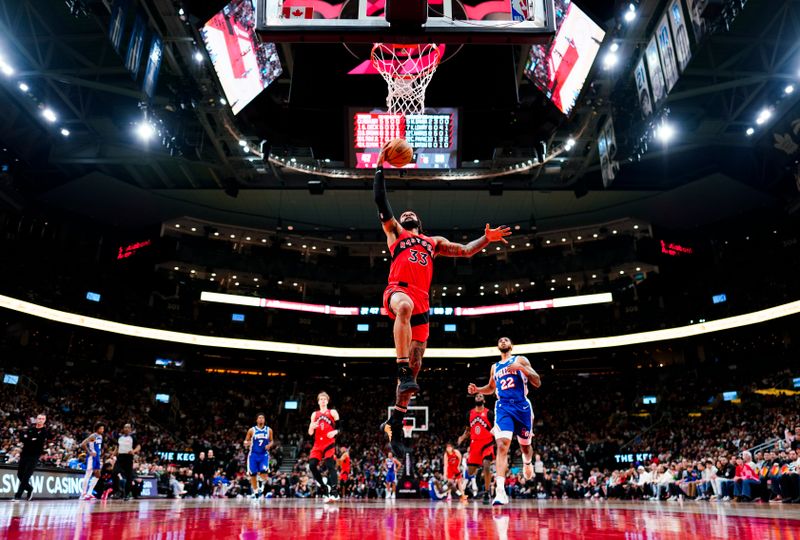 TORONTO, ON - MARCH 31: Gary Trent Jr. #33 of the Toronto Raptors goes to the basket against the Philadelphia 76ers during the first half of their basketball game at the Scotiabank Arena on March 31, 2024 in Toronto, Ontario, Canada. NOTE TO USER: User expressly acknowledges and agrees that, by downloading and/or using this Photograph, user is consenting to the terms and conditions of the Getty Images License Agreement. (Photo by Mark Blinch/Getty Images)