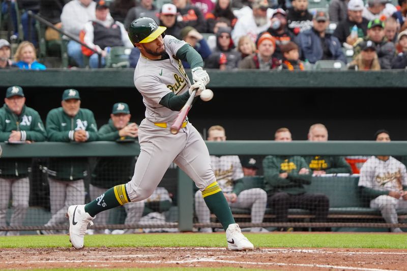 Apr 27, 2024; Baltimore, Maryland, USA; Oakland Athletics first baseman Abraham Toro (31) hits a single against the Baltimore Orioles during the fifth inning at Oriole Park at Camden Yards. Mandatory Credit: Gregory Fisher-USA TODAY Sports