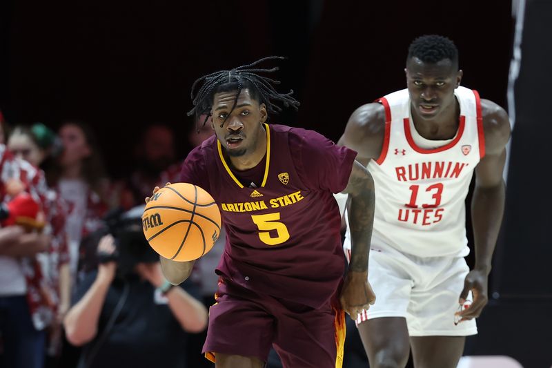 Feb 10, 2024; Salt Lake City, Utah, USA; Arizona State Sun Devils guard Jamiya Neal (5) brings the ball up the court against Utah Utes center Keba Keita (13) during the first half at Jon M. Huntsman Center. Mandatory Credit: Rob Gray-USA TODAY Sports