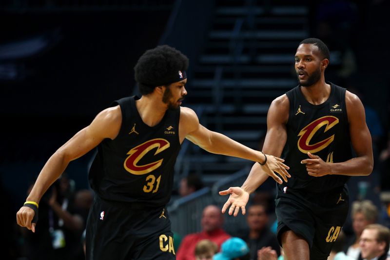 CHARLOTTE, NORTH CAROLINA - MARCH 27: Jarrett Allen #31and Evan Mobley #4 of the Cleveland Cavaliers react during the first half of the game against the Charlotte Hornets at Spectrum Center on March 27, 2024 in Charlotte, North Carolina. NOTE TO USER: User expressly acknowledges and agrees that, by downloading and or using this photograph, User is consenting to the terms and conditions of the Getty Images License Agreement. (Photo by Jared C. Tilton/Getty Images)