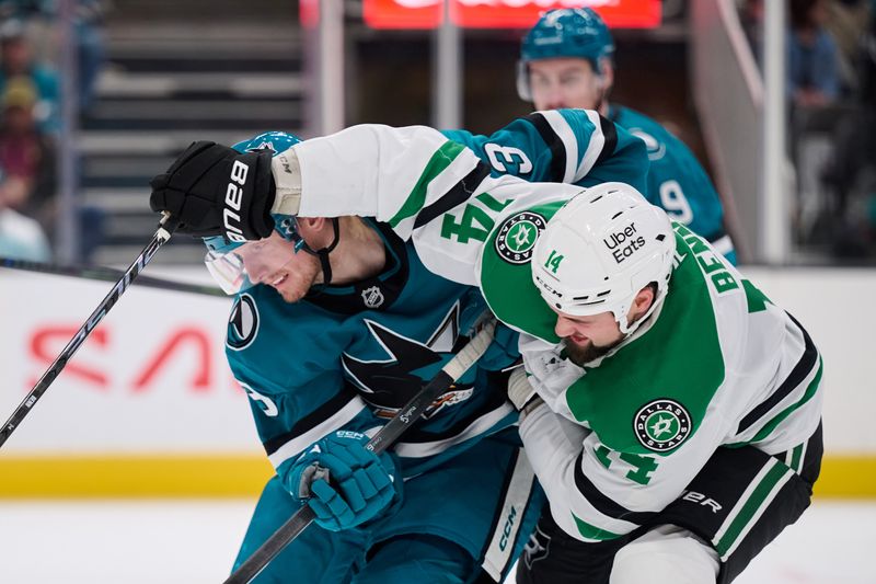 Dec 18, 2025; San Jose, California, USA; San Jose Sharks defenseman John Klingberg (3) vies for the puck against Dallas Stars left wing Jamie Benn (14) during the third period at SAP Center at San Jose. Mandatory Credit: Robert Edwards-Imagn Images
