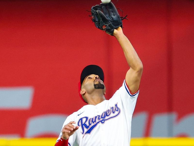 Aug 6, 2024; Arlington, Texas, USA; Texas Rangers second baseman Marcus Semien (2) catches a fly ball during the first inning against the Houston Astros at Globe Life Field. Mandatory Credit: Kevin Jairaj-USA TODAY Sports