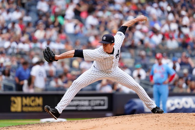 Aug 31, 2024; Bronx, New York, USA; New York Yankees pitcher Tim Hill (54) delivers a pitch against the St. Louis Cardinals during the fifth inning at Yankee Stadium. Mandatory Credit: Gregory Fisher-USA TODAY Sports