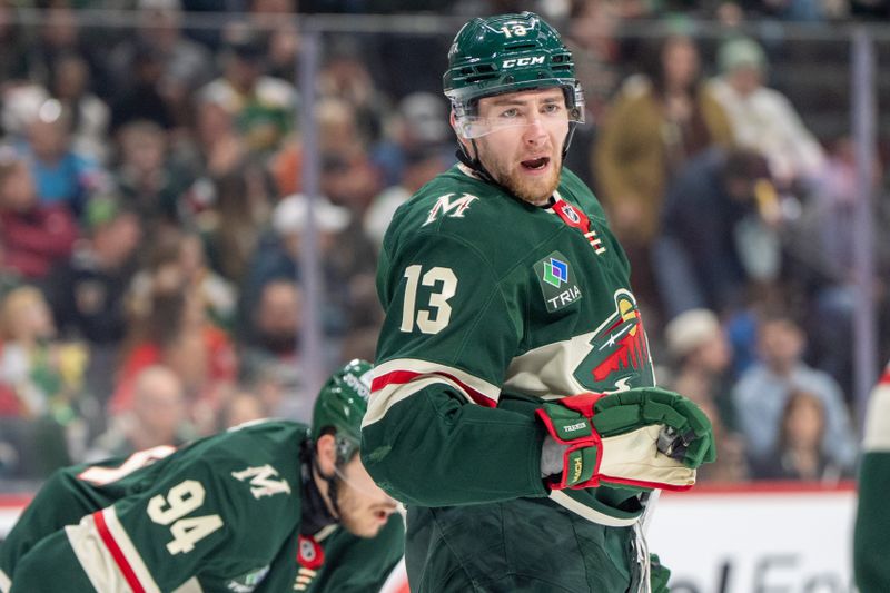 Feb 25, 2025; Saint Paul, Minnesota, USA; Minnesota Wild center Yakov Trenin (13) talks with a teammate before a face off against the Detroit Red Wings in the first period at Xcel Energy Center. Mandatory Credit: Matt Blewett-Imagn Images