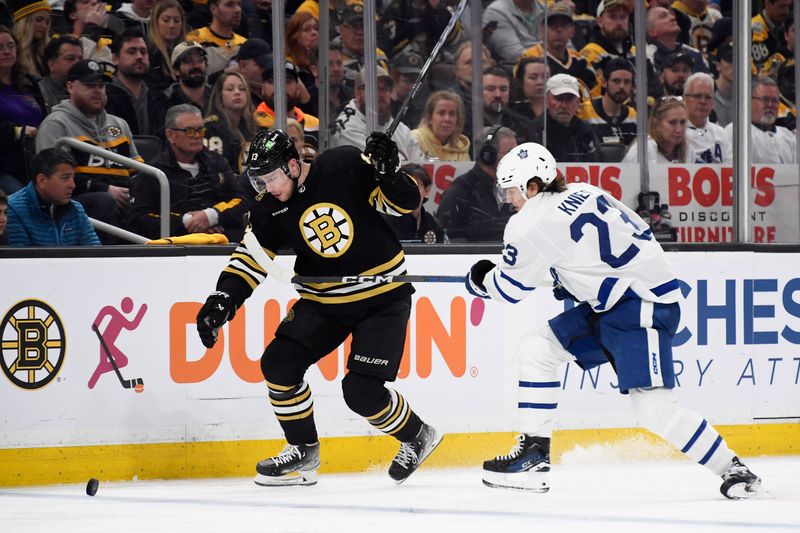 Apr 30, 2024; Boston, Massachusetts, USA; Boston Bruins center Charlie Coyle (13) skates past Toronto Maple Leafs left wing Matthew Knies (23) during the third period in game five of the first round of the 2024 Stanley Cup Playoffs at TD Garden. Mandatory Credit: Bob DeChiara-USA TODAY Sports