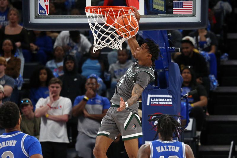 Mar 3, 2024; Memphis, Tennessee, USA; UAB Blazers guard Eric Gaines (4) dunks during the first half against the Memphis Tigers at FedExForum. Mandatory Credit: Petre Thomas-USA TODAY Sports