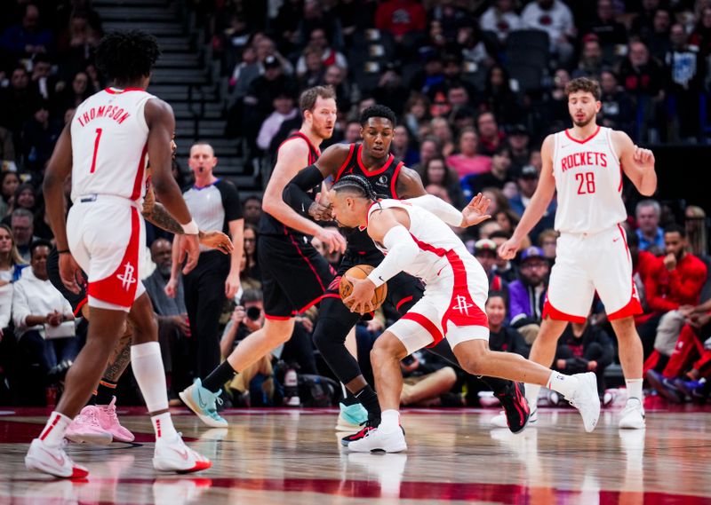 TORONTO, ON - FEBRUARY 9: Dillon Brooks #9 of the Houston Rockets dribbles against RJ Barrett #9 of the Toronto Raptors during the first half of their basketball game at the Scotiabank Arena on February 9, 2024 in Toronto, Ontario, Canada. NOTE TO USER: User expressly acknowledges and agrees that, by downloading and/or using this Photograph, user is consenting to the terms and conditions of the Getty Images License Agreement. (Photo by Mark Blinch/Getty Images)