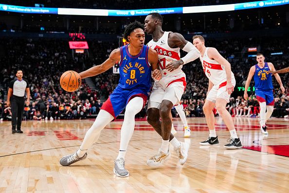 TORONTO, ON - DECEMBER 20: Peyton Watson #8 of the Denver Nuggets battles against Dennis Schroder #17 of the Toronto Raptors during the first half at Scotiabank Arena on December 20, 2023 in Toronto, Ontario, Canada. NOTE TO USER: User expressly acknowledges and agrees that, by downloading and/or using this Photograph, user is consenting to the terms and conditions of the Getty Images License Agreement. (Photo by Andrew Lahodynskyj/Getty Images)