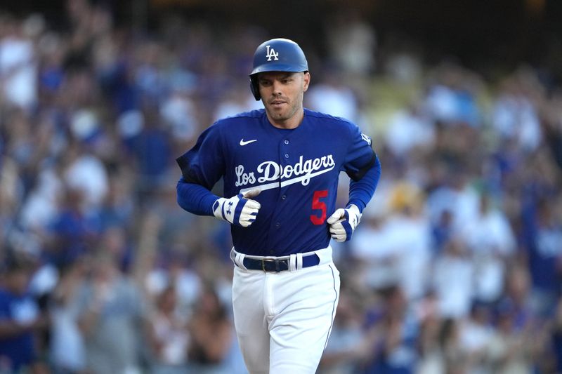 Jul 25, 2023; Los Angeles, California, USA; Los Angeles Dodgers first baseman Freddie Freeman (5) rounds the bases after hitting a solo home run in the first inning against the Toronto Blue Jays at Dodger Stadium. Mandatory Credit: Kirby Lee-USA TODAY Sports