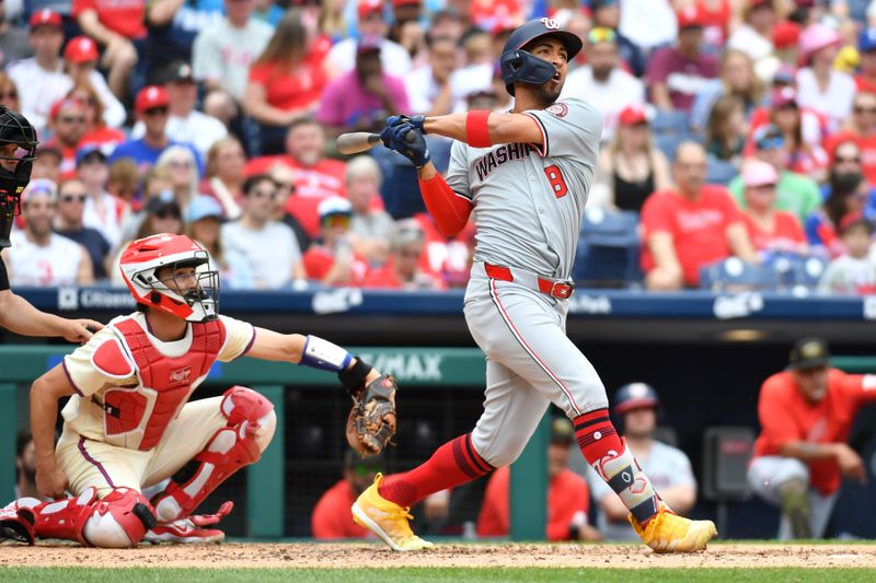 May 19, 2024; Philadelphia, Pennsylvania, USA; Washington Nationals outfielder Eddie Rosario (8) watches his two run home run against the Philadelphia Phillies during the fourth inning at Citizens Bank Park. Mandatory Credit: Eric Hartline-USA TODAY Sports