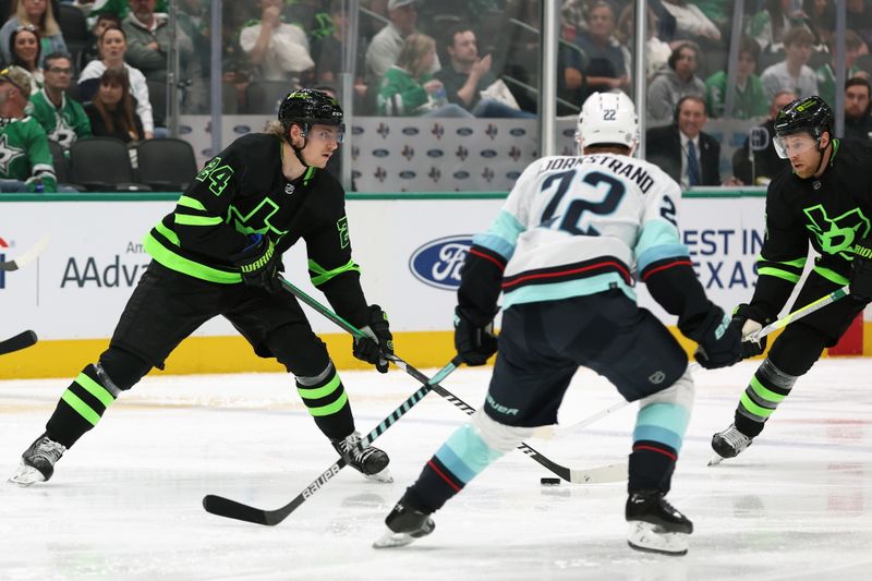 Apr 13, 2024; Dallas, Texas, USA; Dallas Stars center Roope Hintz (24) passes the puck against the Seattle Kraken in the second period at American Airlines Center. Mandatory Credit: Tim Heitman-USA TODAY Sports