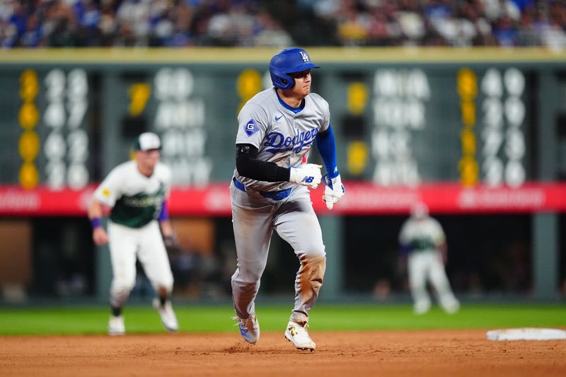 Sep 28, 2024; Denver, Colorado, USA; Los Angeles Dodgers designated hitter Shohei Ohtani (17) advances to third in the sixth inning against the Colorado Rockies at Coors Field. Mandatory Credit: Ron Chenoy-Imagn Images 