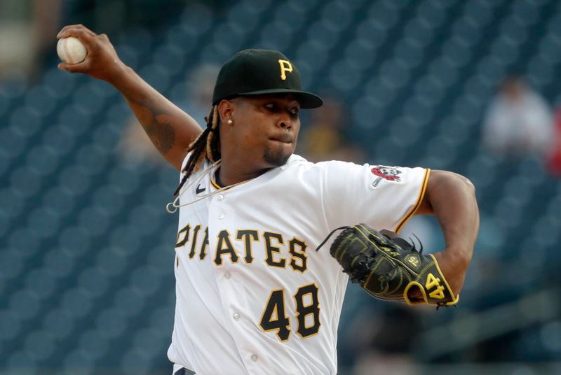 May 22, 2023; Pittsburgh, Pennsylvania, USA;  Pittsburgh Pirates starting pitcher Luis Ortiz (48) delivers a pitch against the Texas Rangers during the first inning at PNC Park. Mandatory Credit: Charles LeClaire-USA TODAY Sports