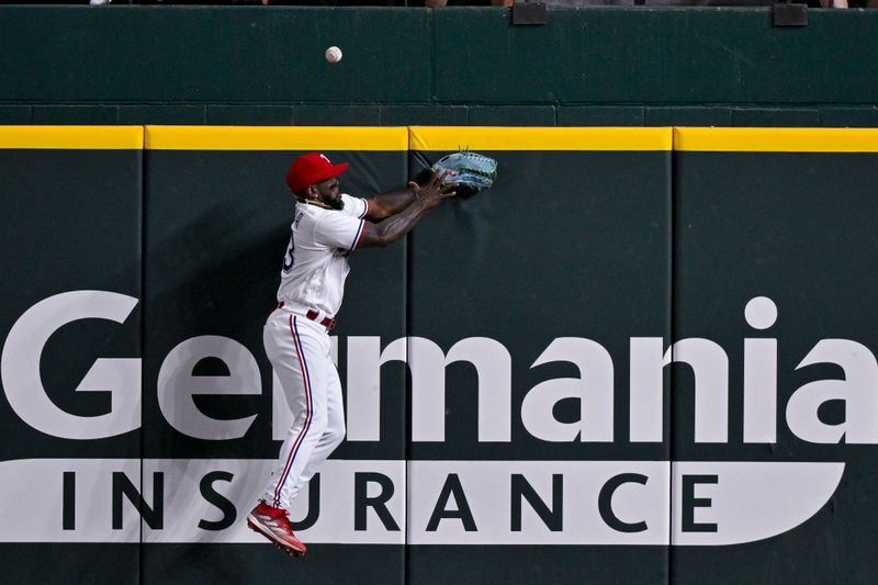 May 16, 2023; Arlington, Texas, USA; Texas Rangers right fielder Adolis Garcia (53) leaps but cannot catch a home run ball hit by Atlanta Braves catcher Sean Murphy (not pictured) during the eighth inning at Globe Life Field. Mandatory Credit: Jerome Miron-USA TODAY Sports