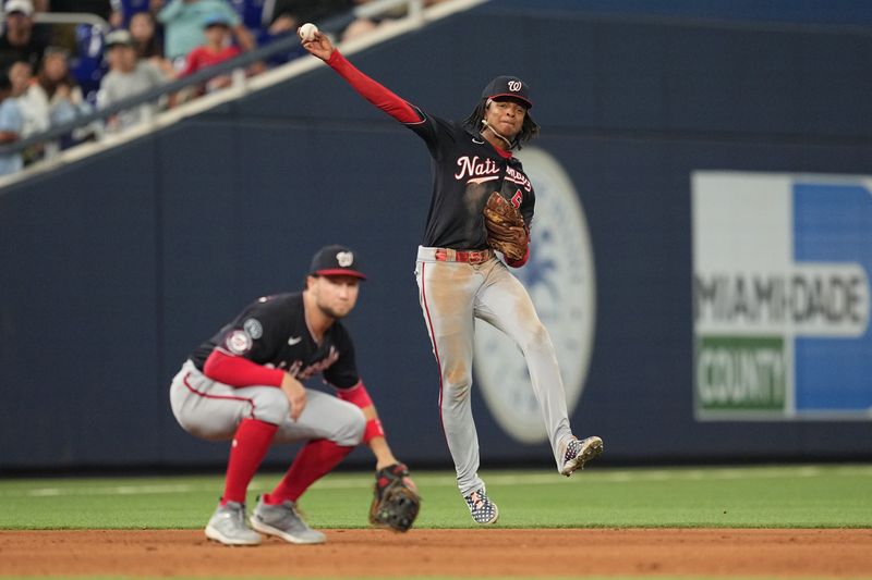 Aug 25, 2023; Miami, Florida, USA; Washington Nationals shortstop CJ Abrams (5) attempts to throw out Miami Marlins third baseman Jake Burger (not pictured) in the seventh inning at loanDepot Park. Mandatory Credit: Jim Rassol-USA TODAY Sports