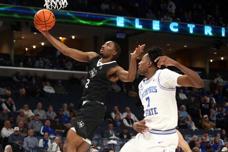 Jan 31, 2024; Memphis, Tennessee, USA; Rice Owls guard Mekhi Mason (2) drives to the basket during the second half against the Memphis Tigers at FedExForum. Mandatory Credit: Petre Thomas-USA TODAY Sports