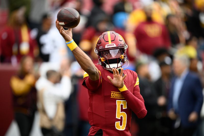 Washington Commanders quarterback Jayden Daniels throws during pregame of an NFL football game against the Pittsburgh Steelers, Sunday, Nov. 10, 2024, in Landover, Md. (AP Photo/Nick Wass)