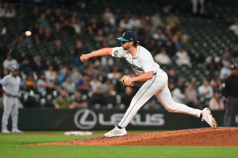 Sep 12, 2024; Seattle, Washington, USA; Seattle Mariners relief pitcher Collin Snider (52) pitches to the Texas Rangers during the eighth inning at T-Mobile Park. Mandatory Credit: Steven Bisig-Imagn Images