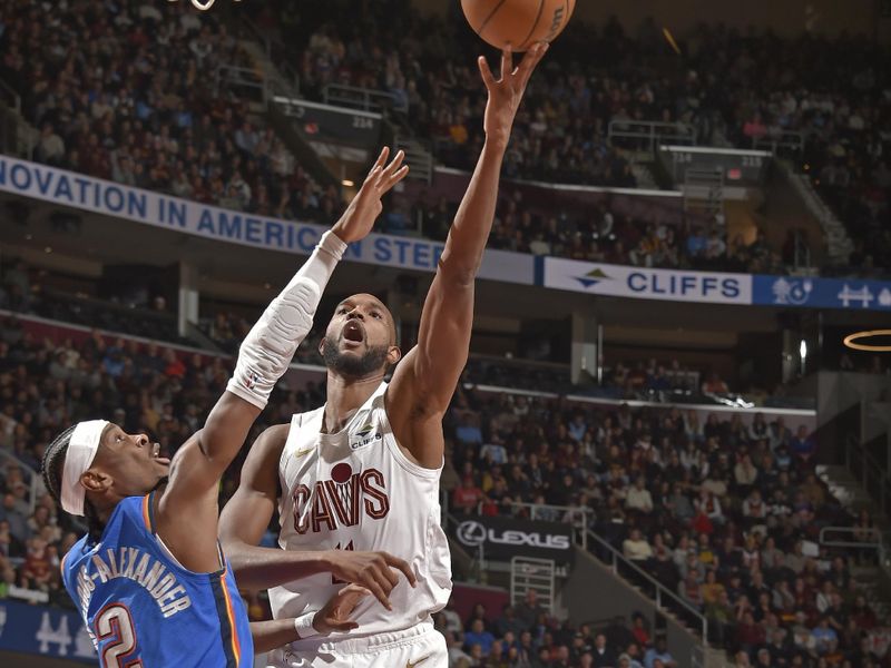 CLEVELAND, OH - JANUARY 8: Evan Mobley #4 of the Cleveland Cavaliers drives to the basket during the game against the Oklahoma City Thunder on January 8, 2025 at Rocket Mortgage FieldHouse in Cleveland, Ohio. NOTE TO USER: User expressly acknowledges and agrees that, by downloading and/or using this Photograph, user is consenting to the terms and conditions of the Getty Images License Agreement. Mandatory Copyright Notice: Copyright 2025 NBAE (Photo by David Liam Kyle/NBAE via Getty Images)