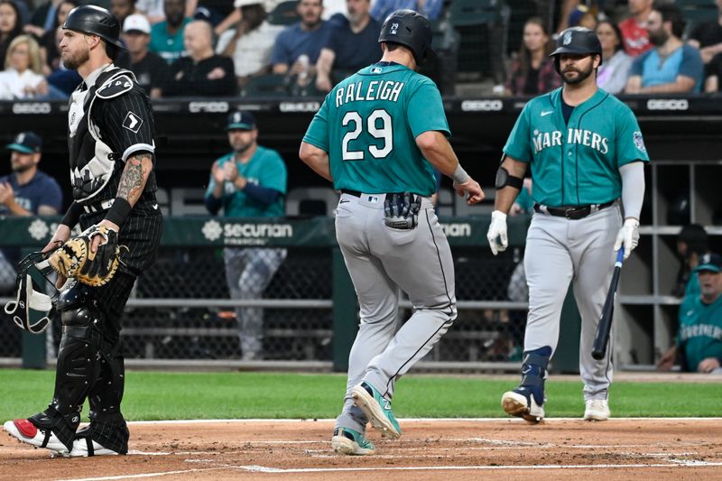 Aug 21, 2023; Chicago, Illinois, USA;  Seattle Mariners catcher Cal Raleigh (29) scores against the Chicago White Sox during the first inning at Guaranteed Rate Field. Mandatory Credit: Matt Marton-USA TODAY Sports