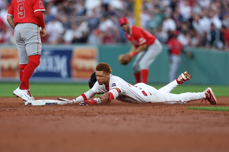 Jun 3, 2025; Boston, Massachusetts, USA; Boston Red Sox second baseman Kristian Campbell (28) slides into second base during the third inning against the Los Angeles Angels at Fenway Park. Mandatory Credit: Paul Rutherford-Imagn Images