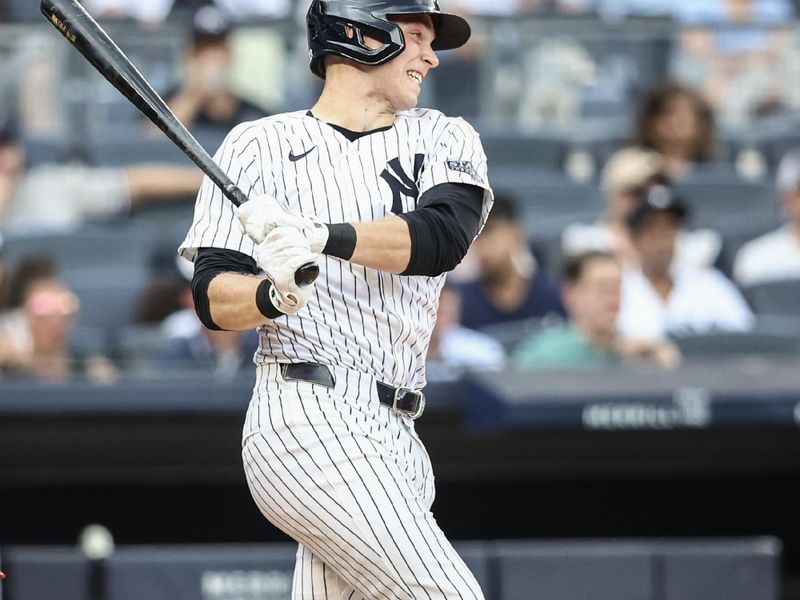 Jun 23, 2024; Bronx, New York, USA;  New York Yankees first baseman Ben Rice (93) hits a single in the fifth inning against the Atlanta Braves at Yankee Stadium. Mandatory Credit: Wendell Cruz-USA TODAY Sports