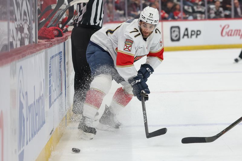 Oct 16, 2025; Newark, New Jersey, USA; Florida Panthers center Luke Kunin (71) plays the puck against the New Jersey Devils during the first period at Prudential Center. Mandatory Credit: Ed Mulholland-Imagn Images