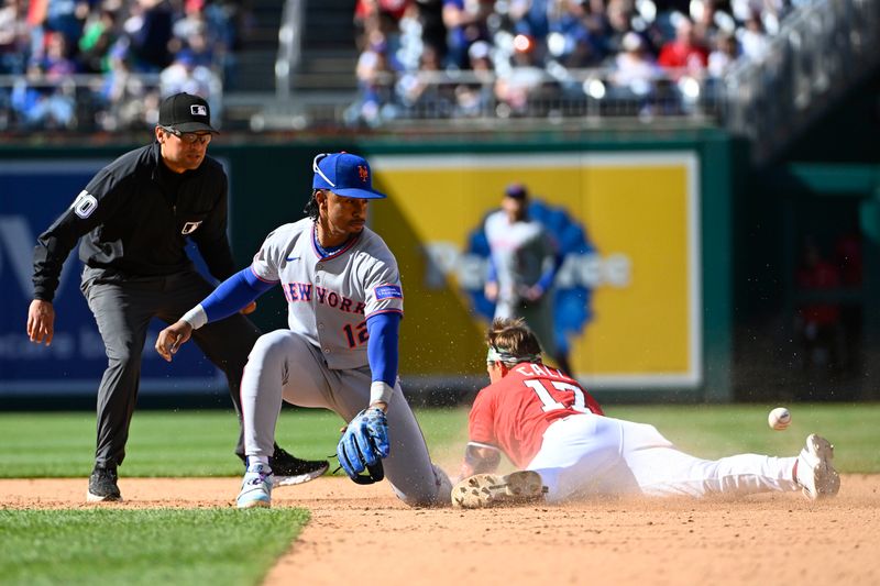 Apr 27, 2025; Washington, District of Columbia, USA; Washington Nationals outfielder Alex Call (17) hits a double beating the tag attempt by New York Mets shortstop Francisco Lindor (12) during the ninth inning at Nationals Park. Mandatory Credit: Brad Mills-Imagn Images