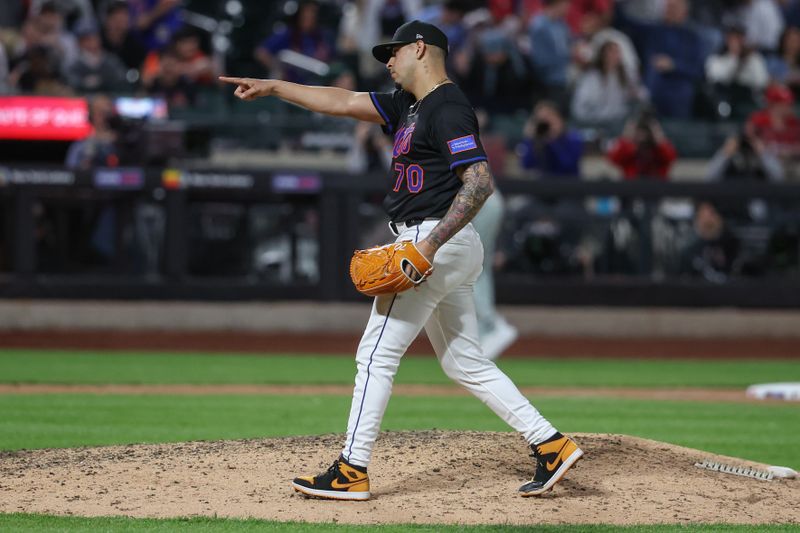 Apr 22, 2025; New York City, New York, USA;  New York Mets relief pitcher José Buttó (70) reacts after beating the Philadelphia Phillies 5-1 at Citi Field. Mandatory Credit: Wendell Cruz-Imagn Images