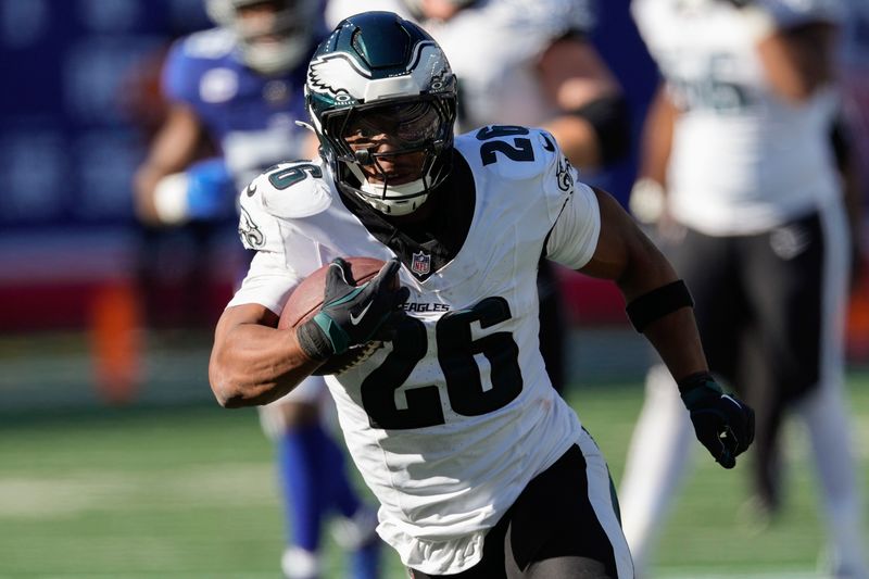 Philadelphia Eagles running back Saquon Barkley (26) carries the ball against the New York Giants during the third quarter of an NFL football game, Sunday, Oct. 20, 2024, in East Rutherford, N.J. (AP Photo/Seth Wenig)