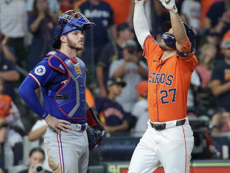 Jul 12, 2024; Houston, Texas, USA; Houston Astros second baseman Jose Altuve (27) celebrates his three run home run while Texas Rangers catcher Jonah Heim (28) watches in the seventh inning at Minute Maid Park. Mandatory Credit: Thomas Shea-USA TODAY Sports