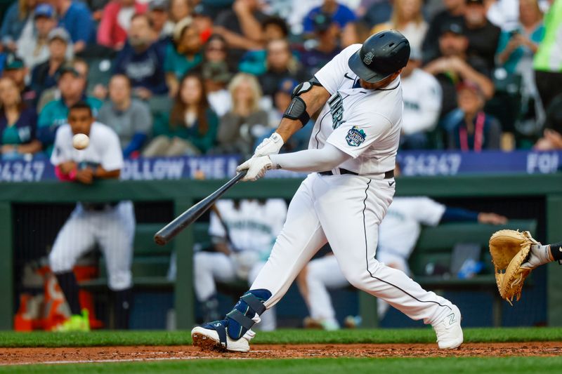 Jun 13, 2023; Seattle, Washington, USA; Seattle Mariners designated hitter Mike Ford (20) hits a two-run home run against the Miami Marlins during the fourth inning at T-Mobile Park. Mandatory Credit: Joe Nicholson-USA TODAY Sports