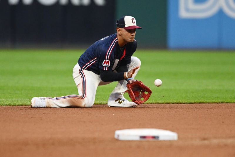 Aug 2, 2024; Cleveland, Ohio, USA; Cleveland Guardians second baseman Andres Gimenez (0) fields a ball hit by Baltimore Orioles first baseman Ryan Mountcastle (not pictured) during the fourth inning at Progressive Field. Mandatory Credit: Ken Blaze-USA TODAY Sports