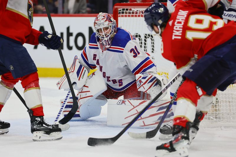 May 26, 2024; Sunrise, Florida, USA; New York Rangers goaltender Igor Shesterkin (31) defends his net against Florida Panthers left wing Matthew Tkachuk (19) during the first period in game three of the Eastern Conference Final of the 2024 Stanley Cup Playoffs at Amerant Bank Arena. Mandatory Credit: Sam Navarro-USA TODAY Sports