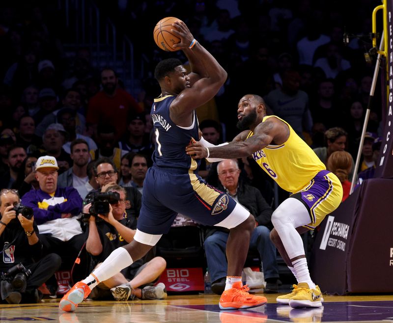 LOS ANGELES, CALIFORNIA - NOVEMBER 02: Zion Williamson #1 of the New Orleans Pelicans drives to the basket on LeBron James #6 of the Los Angeles Lakers during a 120-117 Lakers overtime win at Crypto.com Arena on November 02, 2022 in Los Angeles, California. NOTE TO USER: User expressly acknowledges and agrees that, by downloading and/or using this Photograph, user is consenting to the terms and conditions of the Getty Images License Agreement. Mandatory Copyright Notice: Copyright 2022 NBAE (Photo by Harry How/Getty Images)