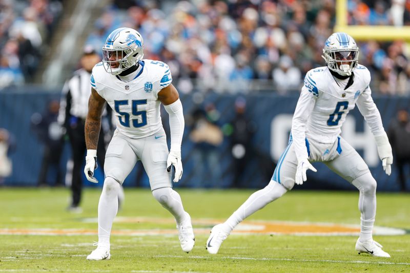 Detroit Lions linebacker Derrick Barnes (55) and safety Ifeatu Melifonwu (6) line up during the first half of an NFL football game against the Chicago Bears, Sunday, Dec. 10, 2023, in Chicago. (AP Photo/Kamil Krzaczynski)