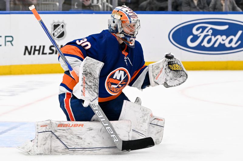 Dec 29, 2023; Elmont, New York, USA; New York Islanders goaltender Ilya Sorokin (30) makes a save against the Washington Capitals during the third period at UBS Arena. Mandatory Credit: Dennis Schneidler-USA TODAY Sports