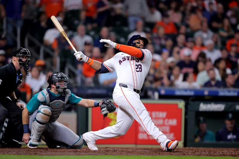May 5, 2024; Houston, Texas, USA; Houston Astros first baseman Jon Singleton (28) hits a two-run home run to right field against the Seattle Mariners during the seventh inning at Minute Maid Park. Mandatory Credit: Erik Williams-USA TODAY Sports
