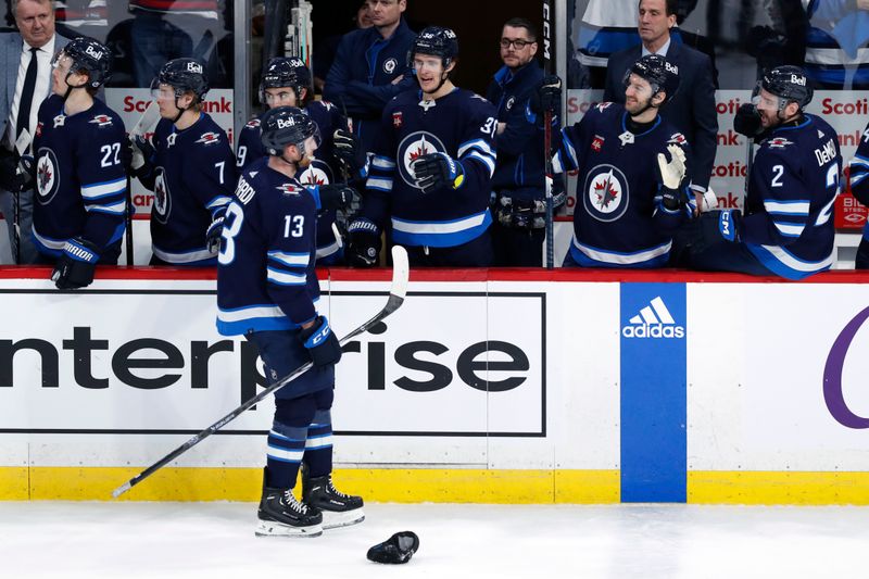 Apr 4, 2024; Winnipeg, Manitoba, CAN; Winnipeg Jets center Gabriel Vilardi (13) celebrates his hat trick goal in the third period against the Calgary Flames at Canada Life Centre. Mandatory Credit: James Carey Lauder-USA TODAY Sports