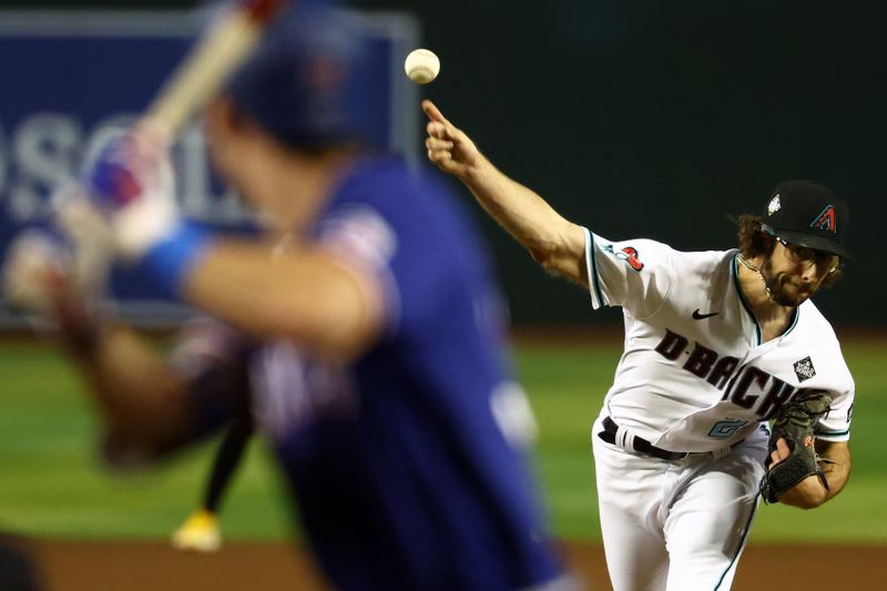 Nov 1, 2023; Phoenix, Arizona, USA; Arizona Diamondbacks starting pitcher Zac Gallen (23) throws a pitch against the Texas Rangers during the sixth inning in game five of the 2023 World Series at Chase Field. Mandatory Credit: Mark J. Rebilas-USA TODAY Sports