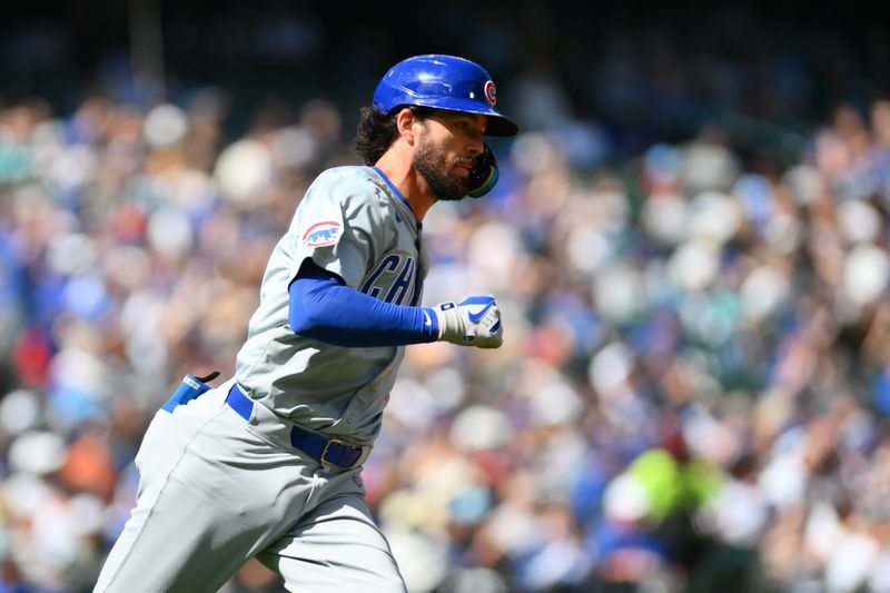 Apr 14, 2024; Seattle, Washington, USA; Chicago Cubs shortstop Dansby Swanson (7) runs towards first base after hitting a double against the Seattle Mariners during the fourth inning at T-Mobile Park. Mandatory Credit: Steven Bisig-USA TODAY Sports