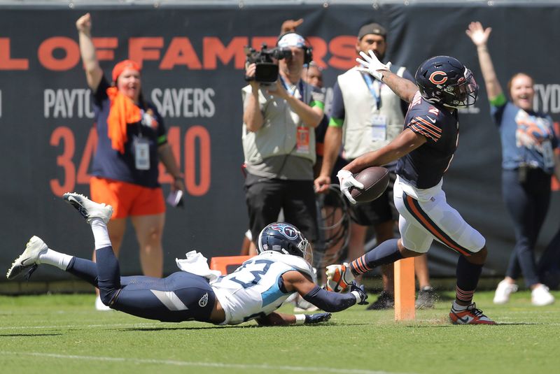 Chicago Bears wide receiver DJ Moore (2) scores a touchdown during the first half an NFL football game against the Tennessee Titans, Saturday, Aug. 12, 2023, in Chicago. (AP Photo/Melissa Tamez)