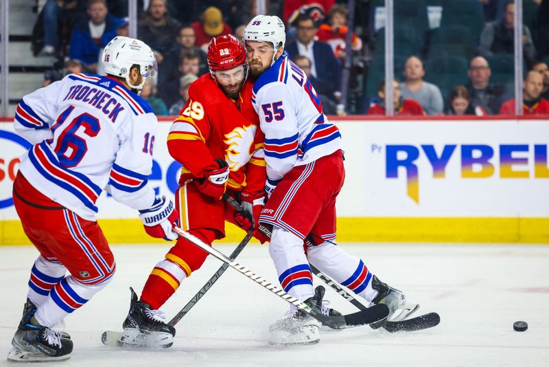 Oct 24, 2023; Calgary, Alberta, CAN; Calgary Flames center Dillon Dube (29) and New York Rangers defenseman Ryan Lindgren (55) collide during the second period at Scotiabank Saddledome. Mandatory Credit: Sergei Belski-USA TODAY Sports