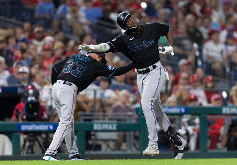 Sep 8, 2023; Philadelphia, Pennsylvania, USA; Miami Marlins right fielder Jesus Sanchez (7) celebrates with third base/infield coach Jody Reed (33) after hitting a two RBI home run during the sixth inning against the Philadelphia Phillies at Citizens Bank Park. Mandatory Credit: Bill Streicher-USA TODAY Sports