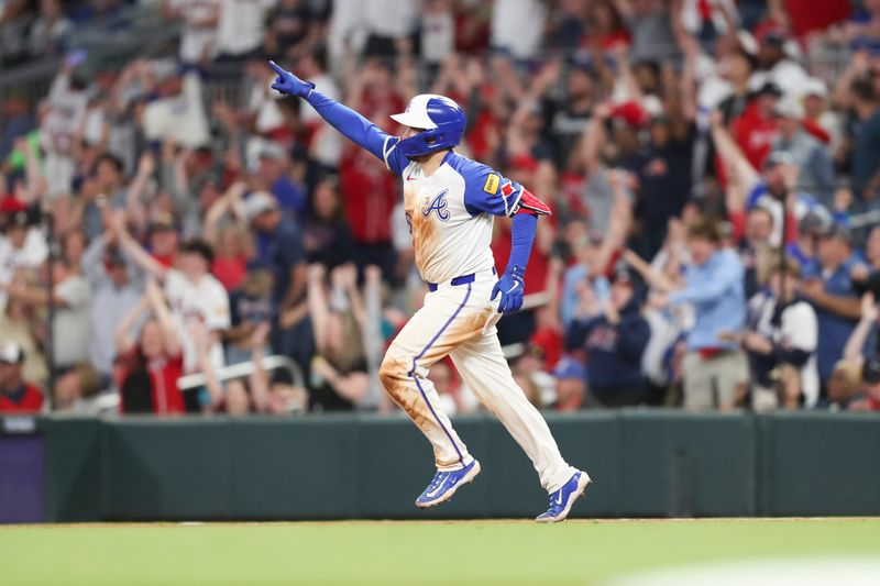 Apr 20, 2024; Cumberland, Georgia, USA;  Atlanta Braves catcher Travis d'Arnaud (16) reacts to his home run against the Texas Rangers in the eighth inning at Truist Park. Mandatory Credit: Mady Mertens-USA TODAY Sports